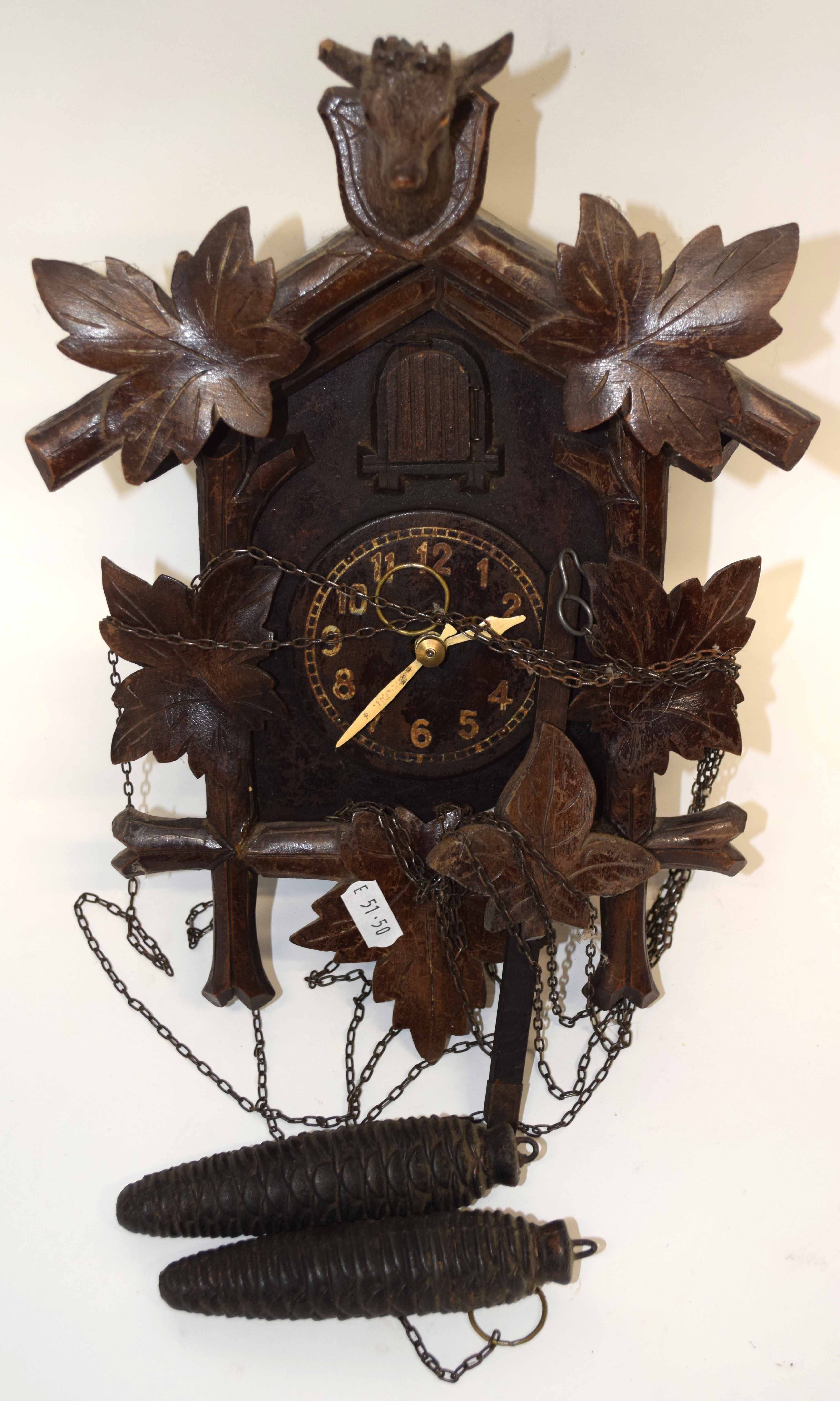 Early 20th century Black Forest cuckoo clock, case height max 31cm, typical decoration mounted