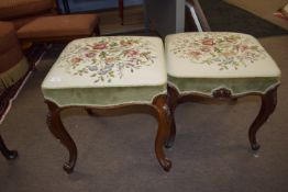 Pair of 19th century mahogany framed stools with decoratively carved legs and later needlework