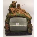 Early 20th century plaster model of two boys fishing with glass bowl in set