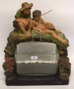 Early 20th century plaster model of two boys fishing with glass bowl in set