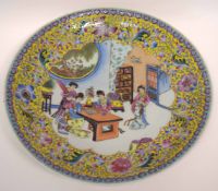 Modern Chinese porcelain charger with polychrome decoration of Chinese ladies to centre,