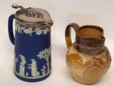 Wedgwood style jasperware jug with blue and white figures together with a Royal Doulton stoneware