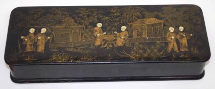 Chinese rectangular box and cover with gilt lacquer decoration to top, with Chinese figures beside a