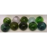 Ten glass balls, eight coloured green, two clear (10)