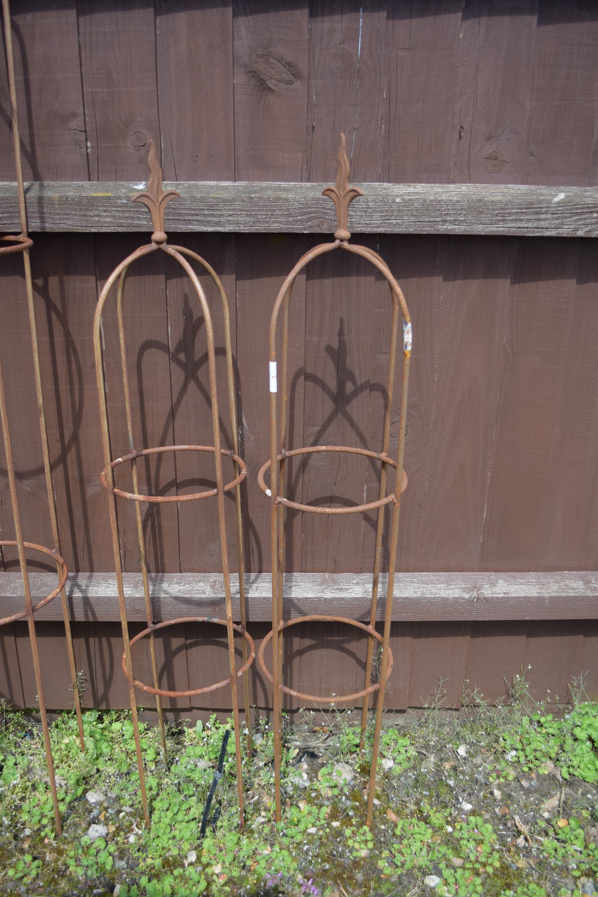 SMALL PAIR OF GARDEN OBELISKS WITH FLEUR DE LYS FINIALS