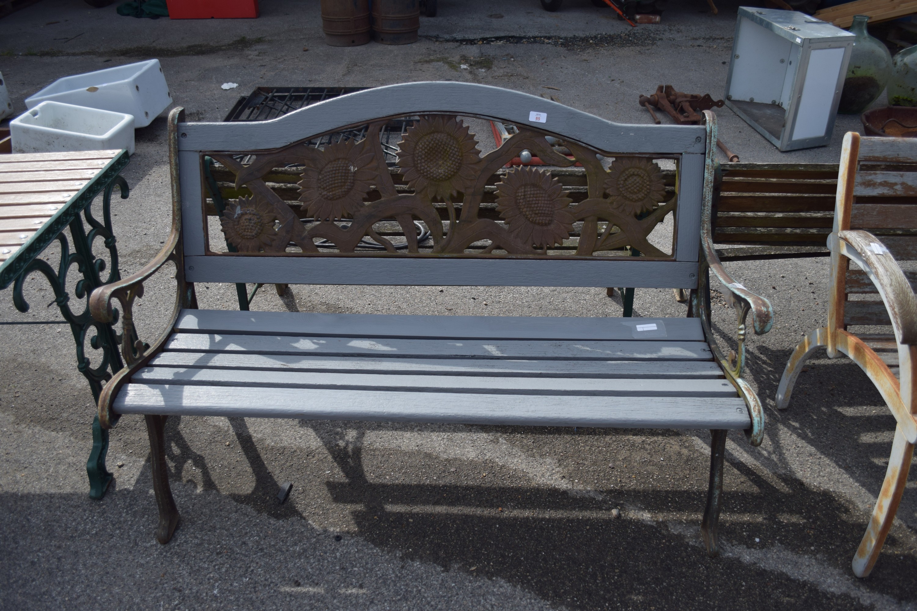 METAL AND WOOD GARDEN BENCH WITH DECORATIVE BACK MOULDED AS SUNFLOWERS
