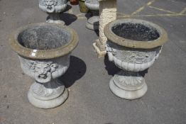 PAIR OF LARGE MOULDED COMPOSITION URNS WITH LION HEADS AND SCROLL WORK DECORATION