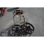 THREE CAST WHEELS TOGETHER WITH A TRIVET ETC