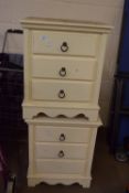 PAIR OF PAINTED RING HANDLED BEDSIDE THREE DRAWER CABINETS, 58CM HIGH