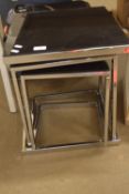 NEST OF THREE CHROME PLATED AND GLASS COFFEE TABLES, 45CM HIGH