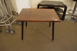 CIRCA MID 20TH CENTURY TEAK COFFEE TABLE WITH BLACK PAINTED SUPPORTS 49CM HIGH