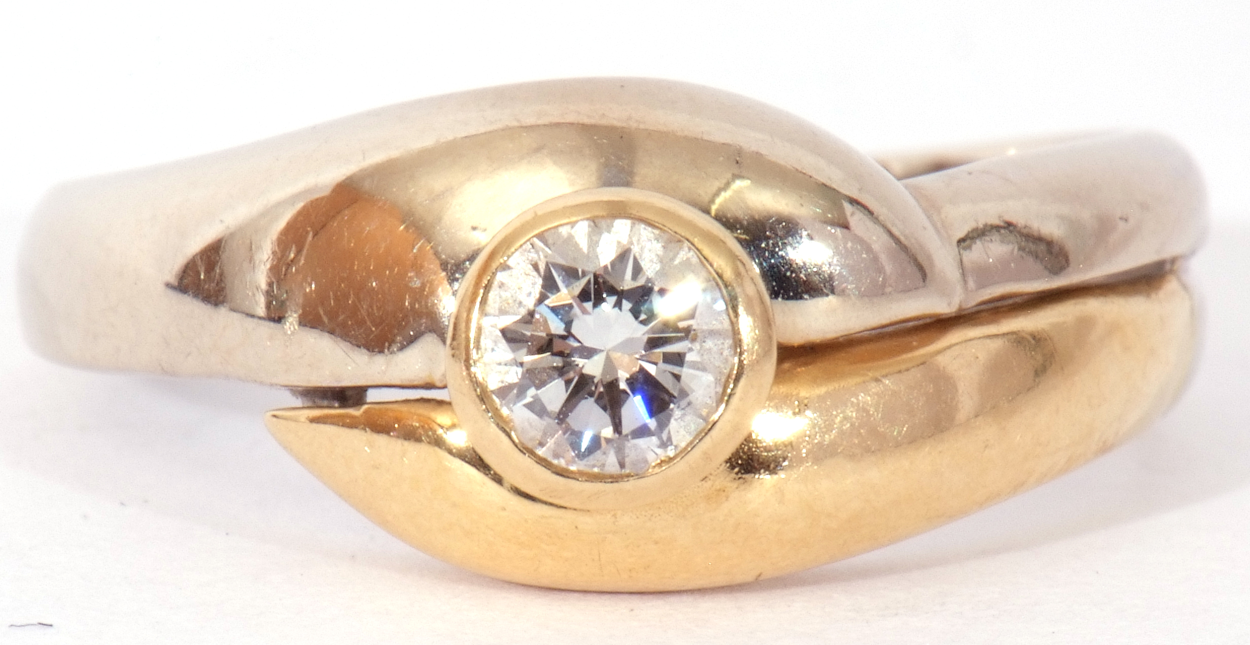 18ct gold brilliant cut solitaire diamond ring, the bezel set diamond raised above two-tone cross