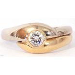18ct gold brilliant cut solitaire diamond ring, the bezel set diamond raised above two-tone cross