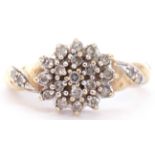 Modern diamond cluster ring, the centre cluster with 19 small diamonds in a flowerhead design, the
