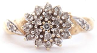 Modern diamond cluster ring, the centre cluster with 19 small diamonds in a flowerhead design, the