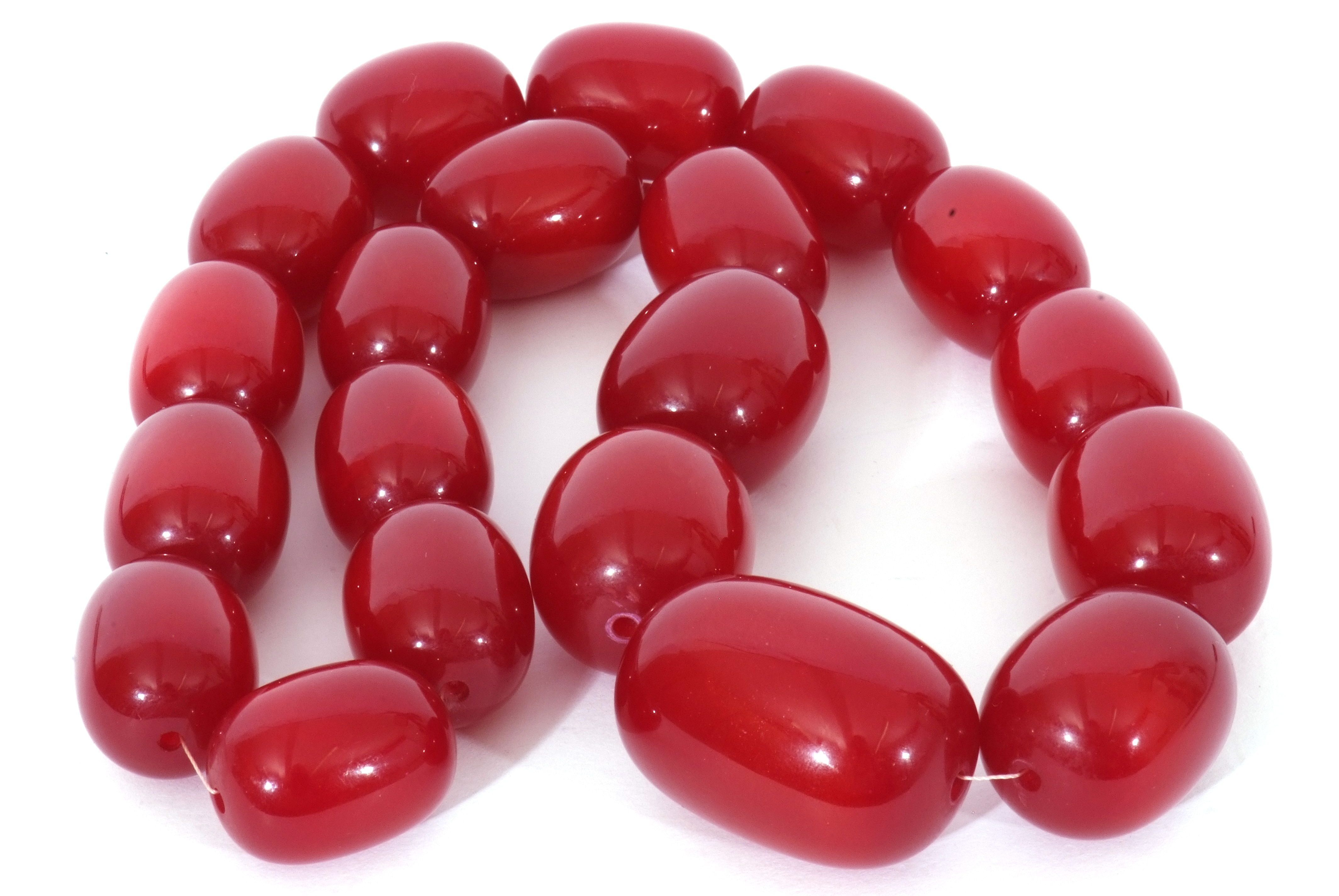Single row of graduated drum shaped cherry coloured beads, 2.5 to 4mm diam