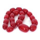 Single row of graduated drum shaped cherry coloured beads, 2.5 to 4mm diam