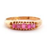 Victorian 18ct gold ruby five stone ring, featuring five mixed cut small rubies, line set in a