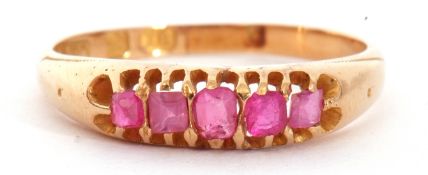 Victorian 18ct gold ruby five stone ring, featuring five mixed cut small rubies, line set in a