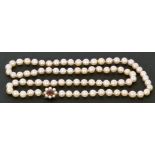 Single row of cultured pearls of uniform shape (7.5mm approx) to a 9ct gold amethyst and seed