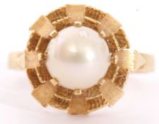 Modern yellow metal and cultured pearl ring centring a cultured pearl, 6mm diam, multi-claw set