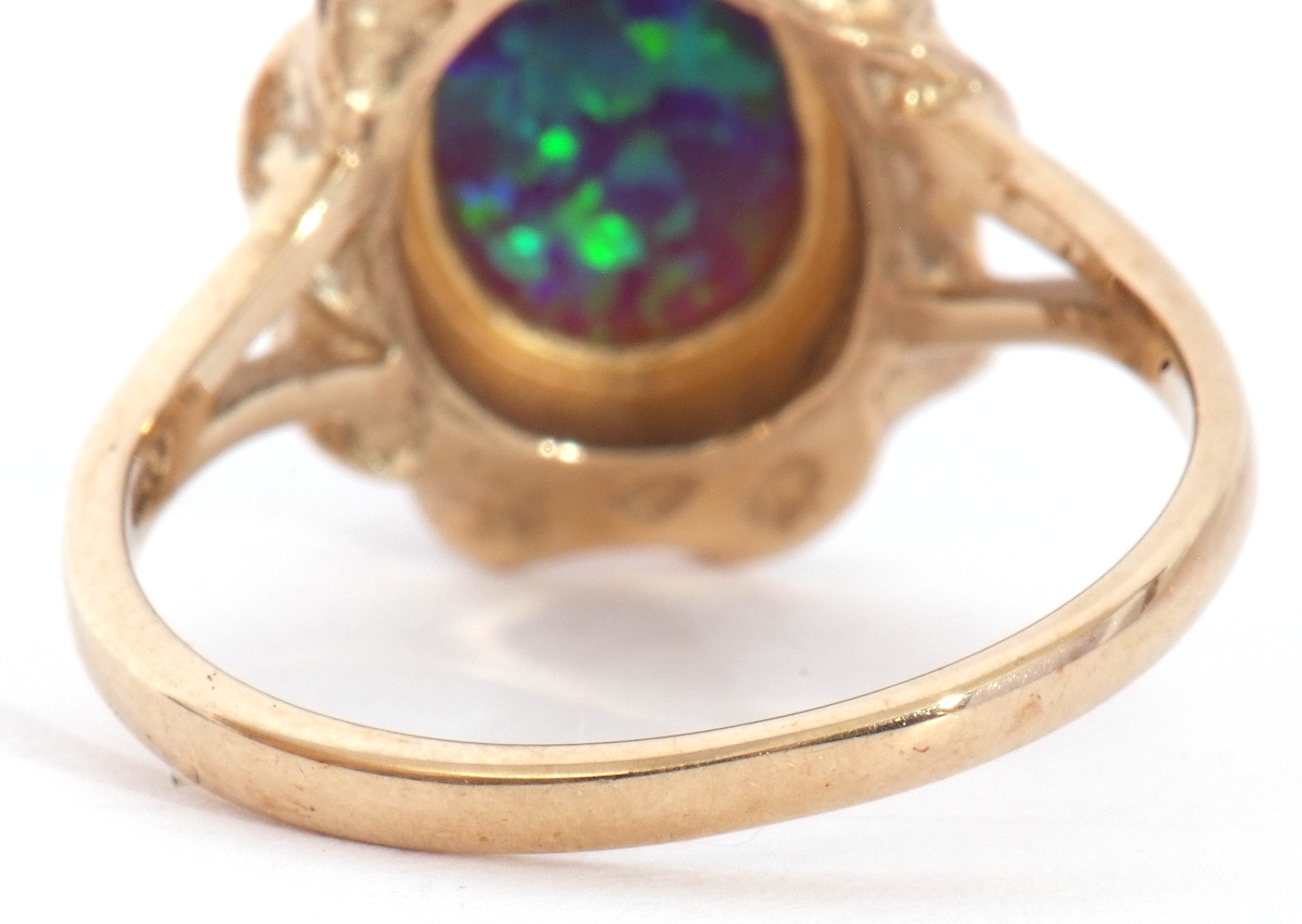 Modern 9ct gold and opalescent ring, the oval cabochon bezel set in a rope twist and pierced - Image 5 of 8