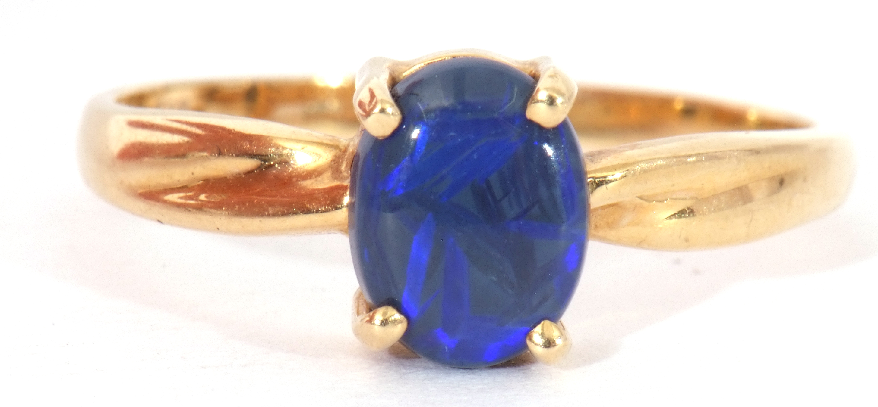 Modern black opal doublet ring, the oval shaped opal is four claw set and raised in a plain polished - Image 7 of 8