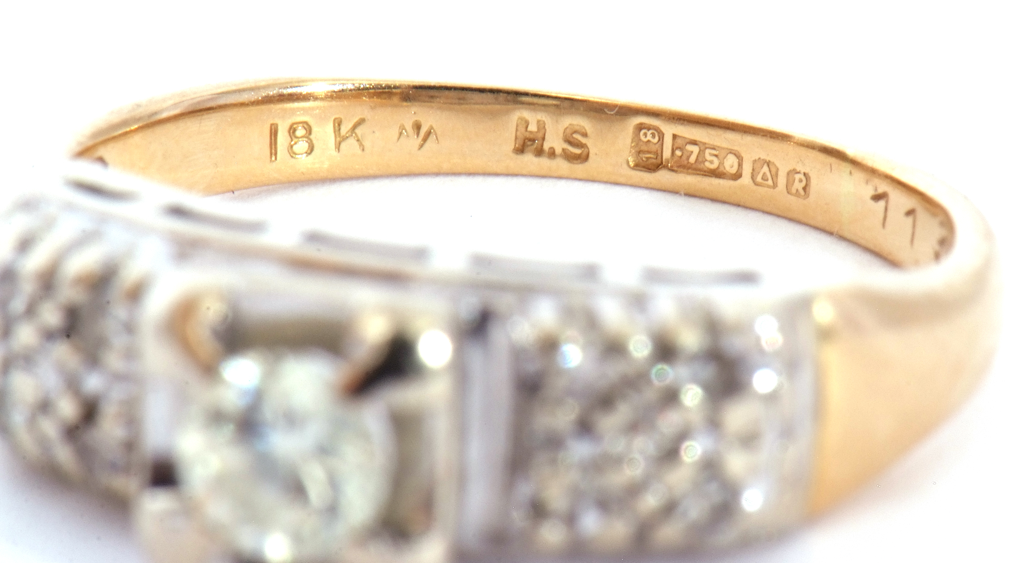 750 stamped diamond ring centring a round brilliant cut diamond, 0.20ct approx, raised above diamond - Image 7 of 8