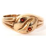 9ct gold serpent ring centring a double headed serpent, each with a paste set eye, 2.4gms, size N