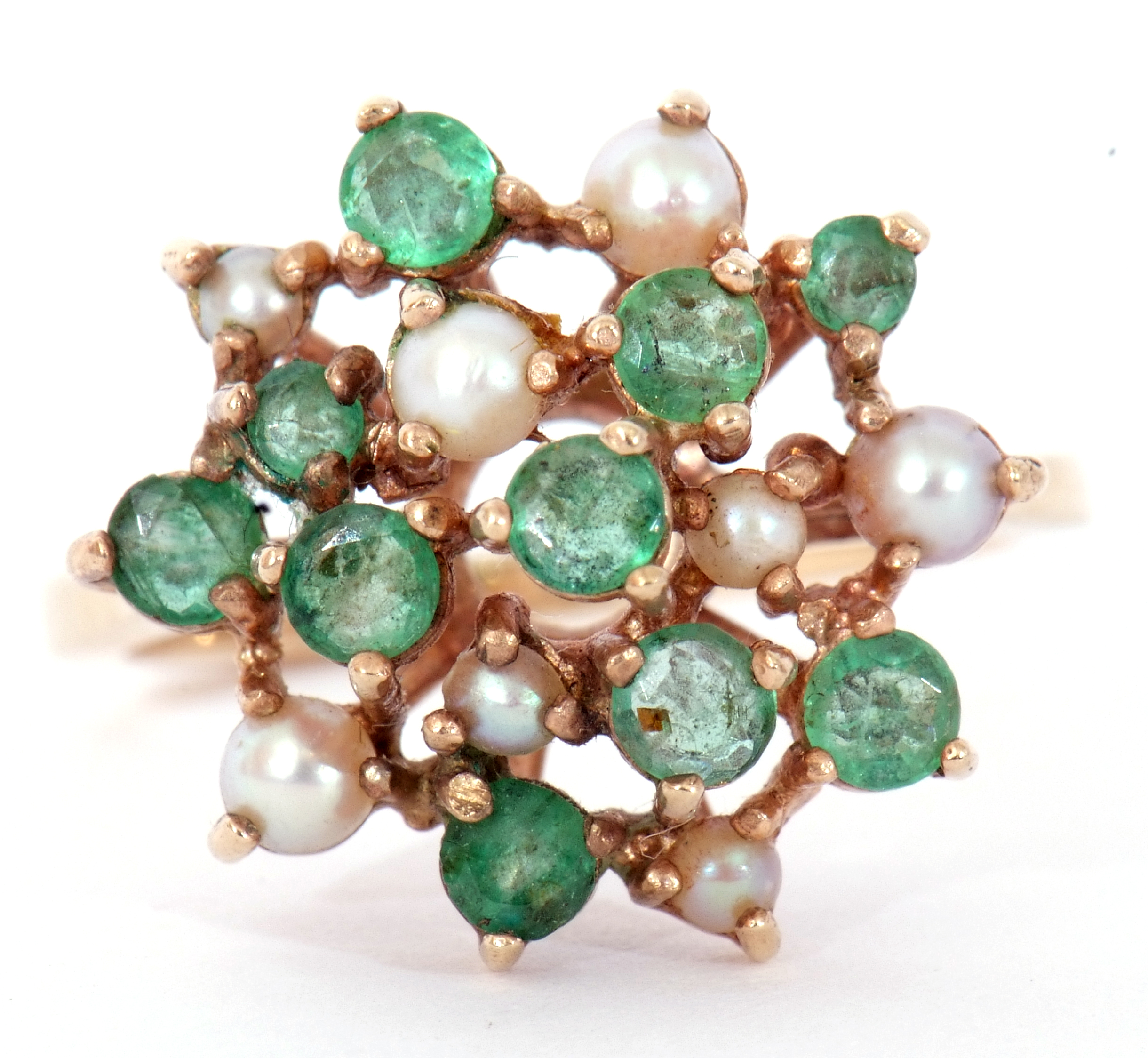 9ct gold emerald and seed pearl cluster ring, a large flowerhead design featuring 10 small round cut