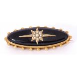 Victorian black onyx and seed pearl and gold mourning brooch, an elongated design, the black onyx