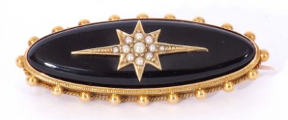 Victorian black onyx and seed pearl and gold mourning brooch, an elongated design, the black onyx