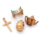 Mixed Lot: four 9ct gold charm/pendants to include unusual enamel and gold model of a baby in a