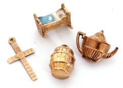 Mixed Lot: four 9ct gold charm/pendants to include unusual enamel and gold model of a baby in a