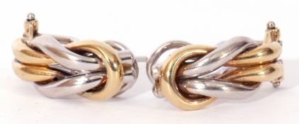 Pair of modern two-tone 9ct gold stylised earrings, 2cm long, with clip and post fittings, 6.6gms