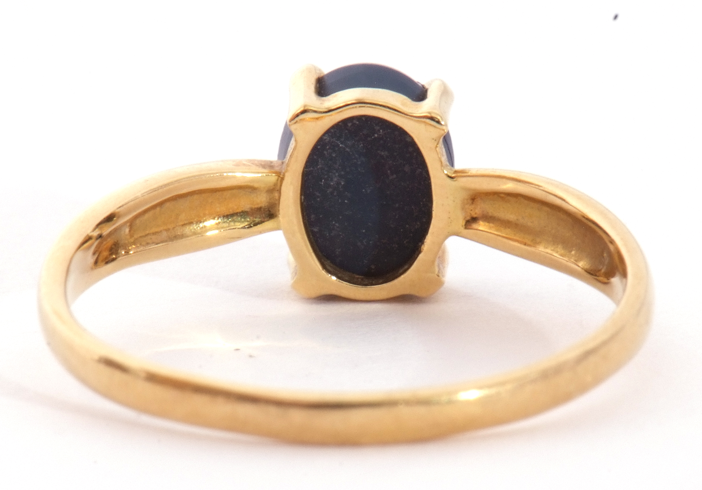 Modern black opal doublet ring, the oval shaped opal is four claw set and raised in a plain polished - Image 4 of 8