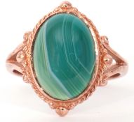 Modern 9ct gold and green quartz ring, centring a cabochon green quartz stone raised in a bezel