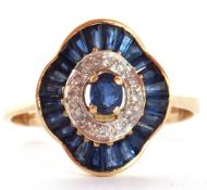Sapphire and diamond "ballerina" style cluster ring featuring a centre sapphire surrounded by 12