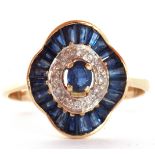Sapphire and diamond "ballerina" style cluster ring featuring a centre sapphire surrounded by 12