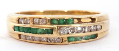 Emerald and diamond set half hoop ring, an Art Deco design of three bands of channel set diamonds