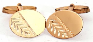 Pair of gents cuff links, the oval shaped panels part chased and engraved, swivel fittings and