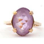 Modern 9ct gold pale purple stone ring, the oval faceted purple stone four claw set raised in a