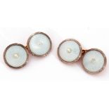 Cased pair of mother of pearl and seed pearl cuff links, the circular engraved mother of pearl