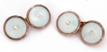 Cased pair of mother of pearl and seed pearl cuff links, the circular engraved mother of pearl