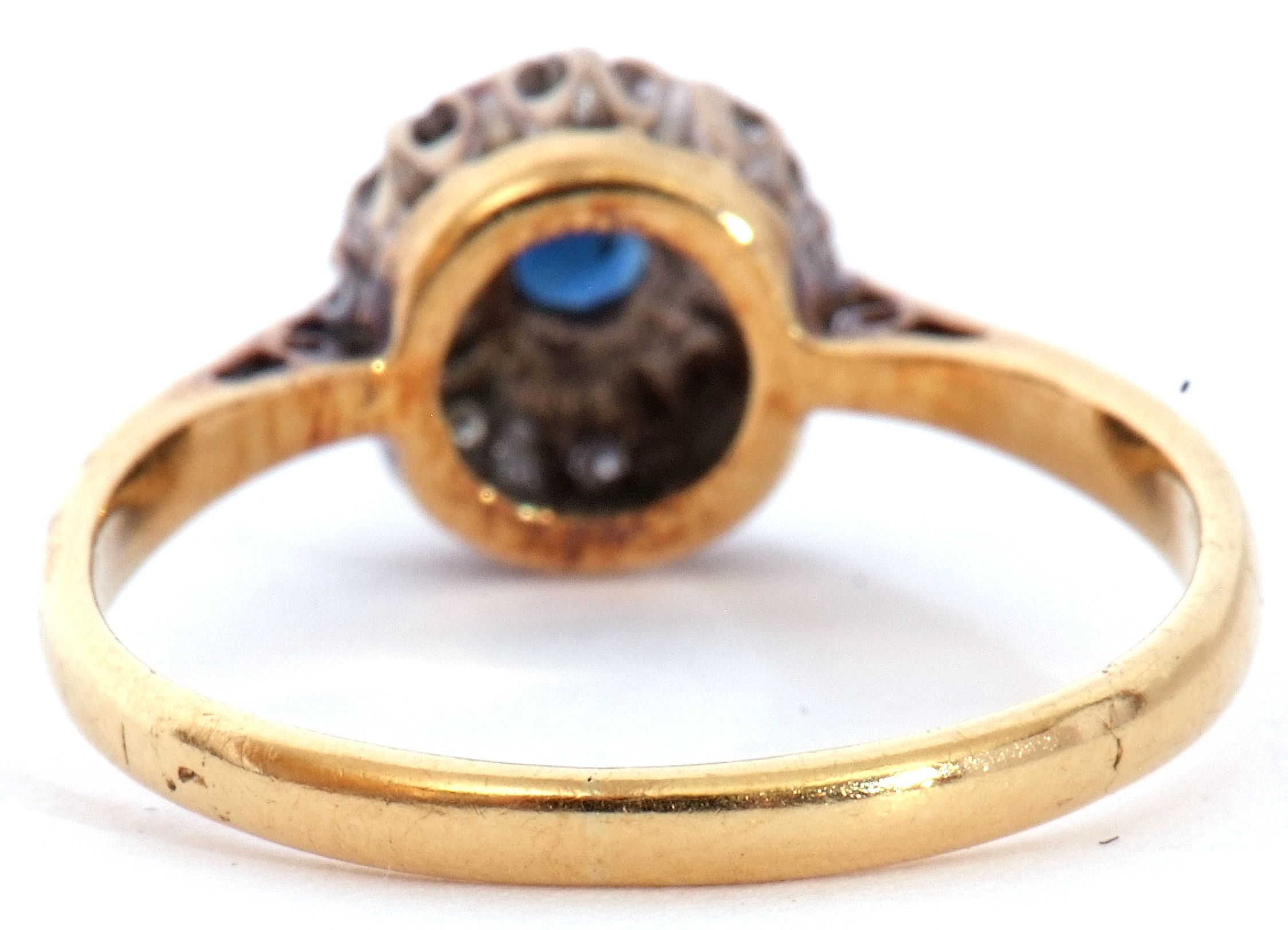Sapphire and diamond cluster ring, the round faceted cut sapphire raised above a small diamond - Image 5 of 6