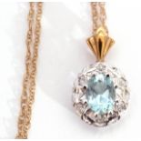 Modern 9ct white gold aquamarine and diamond pendant centring an oval faceted aquamarine raised