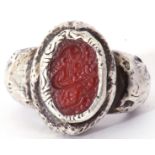 Modern large white metal cast ring featuring an oval engraved carnelian panel in rub-over setting,