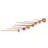 Mixed Lot: seven various stick pins to include a Victorian shield, an old cut diamond set pin, a 14k