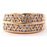 Modern diamond set ring featuring four pierced rows of small diamonds between triangular settings,