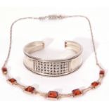 Mixed Lot: white metal torc bangle stamped 925, together with a modern amber necklace stamped 925 (